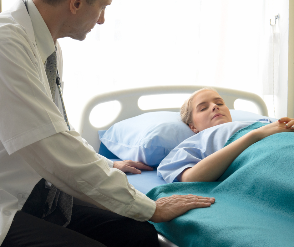 A person in a hospital bed receiving inpatient treatment