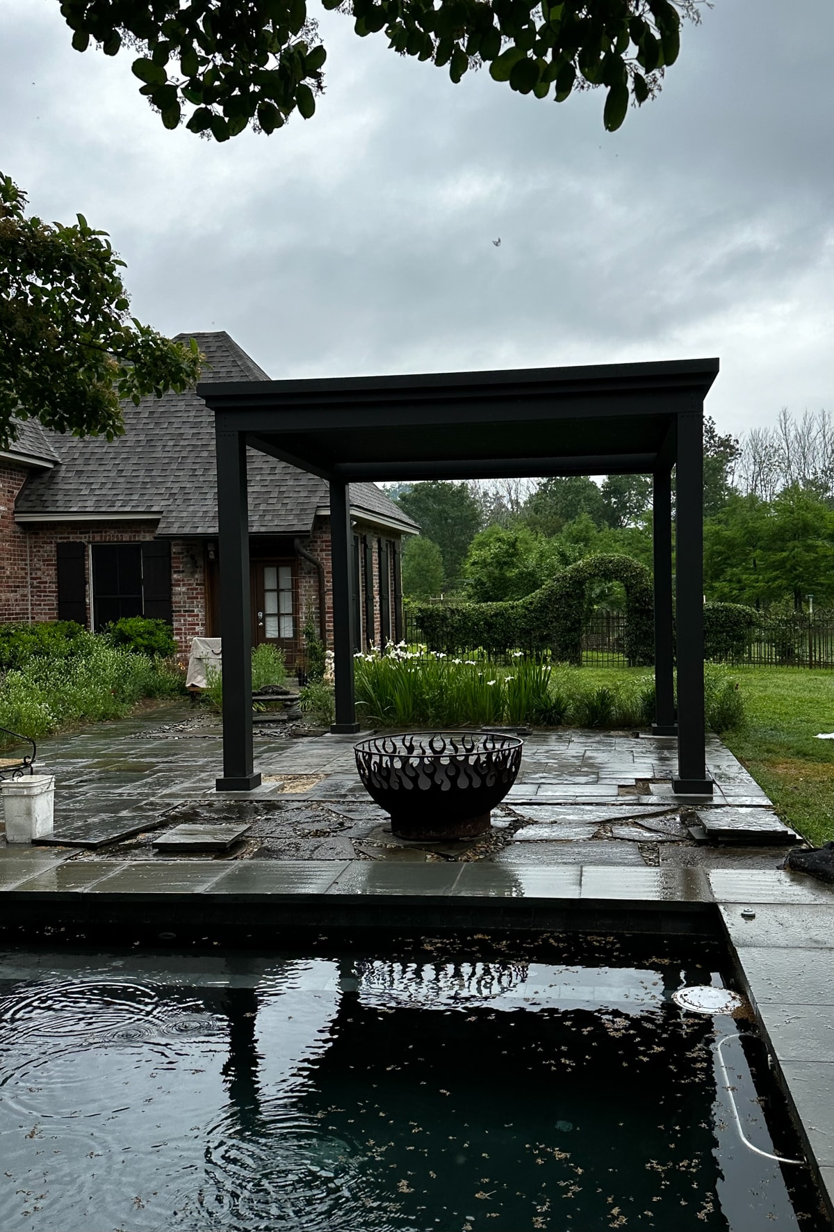 A free standing pergola kit will keep you out of the elements.