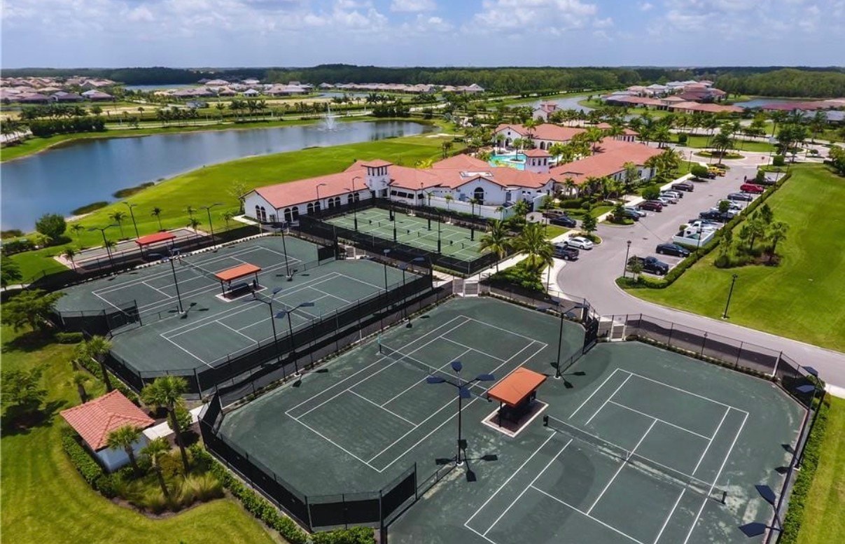 The image showcases a modern single-family home exterior, featuring Lennar's contemporary architectural design with energy-efficient elements. This beautiful home is part of the Arborwood Preserve community in Fort Myers, highlighting the neighborhood's commitment to stylish living and sustainability.