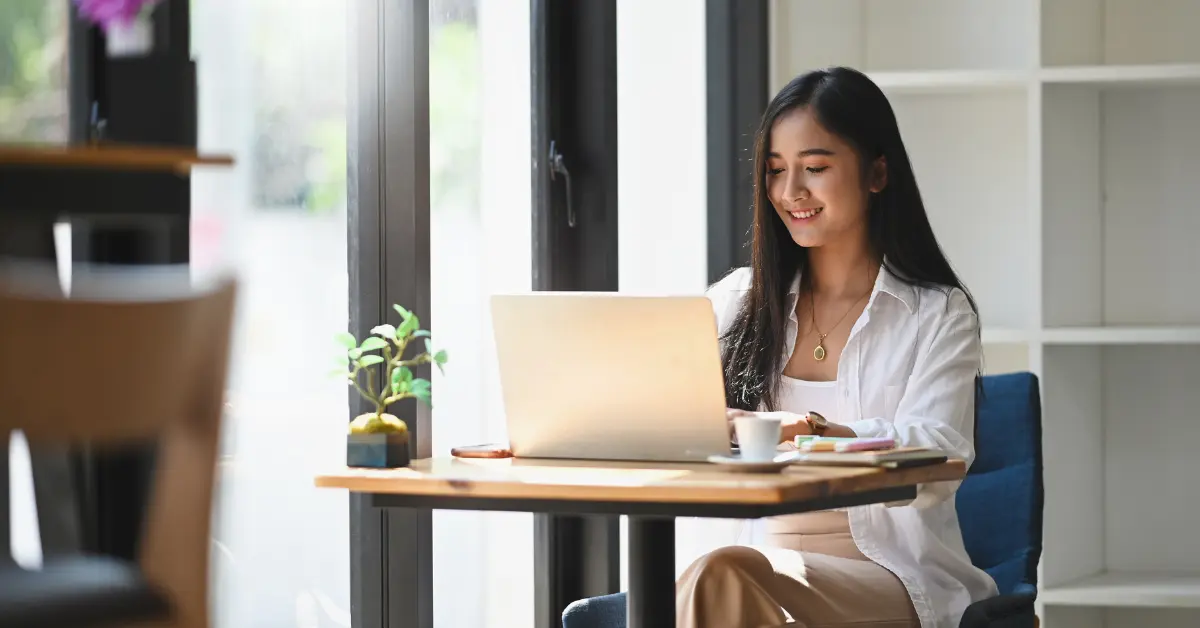 A woman searching on her laptop about OnlyFans tax write-offs.