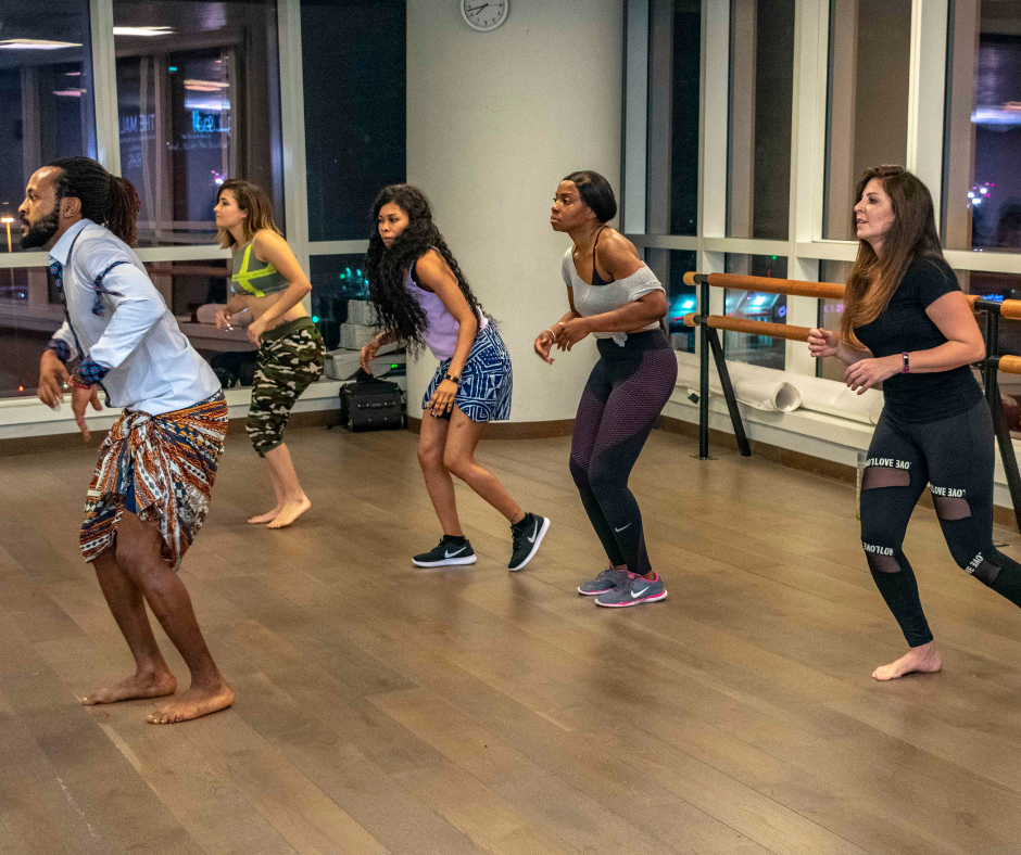 Group of people doing exercise class together