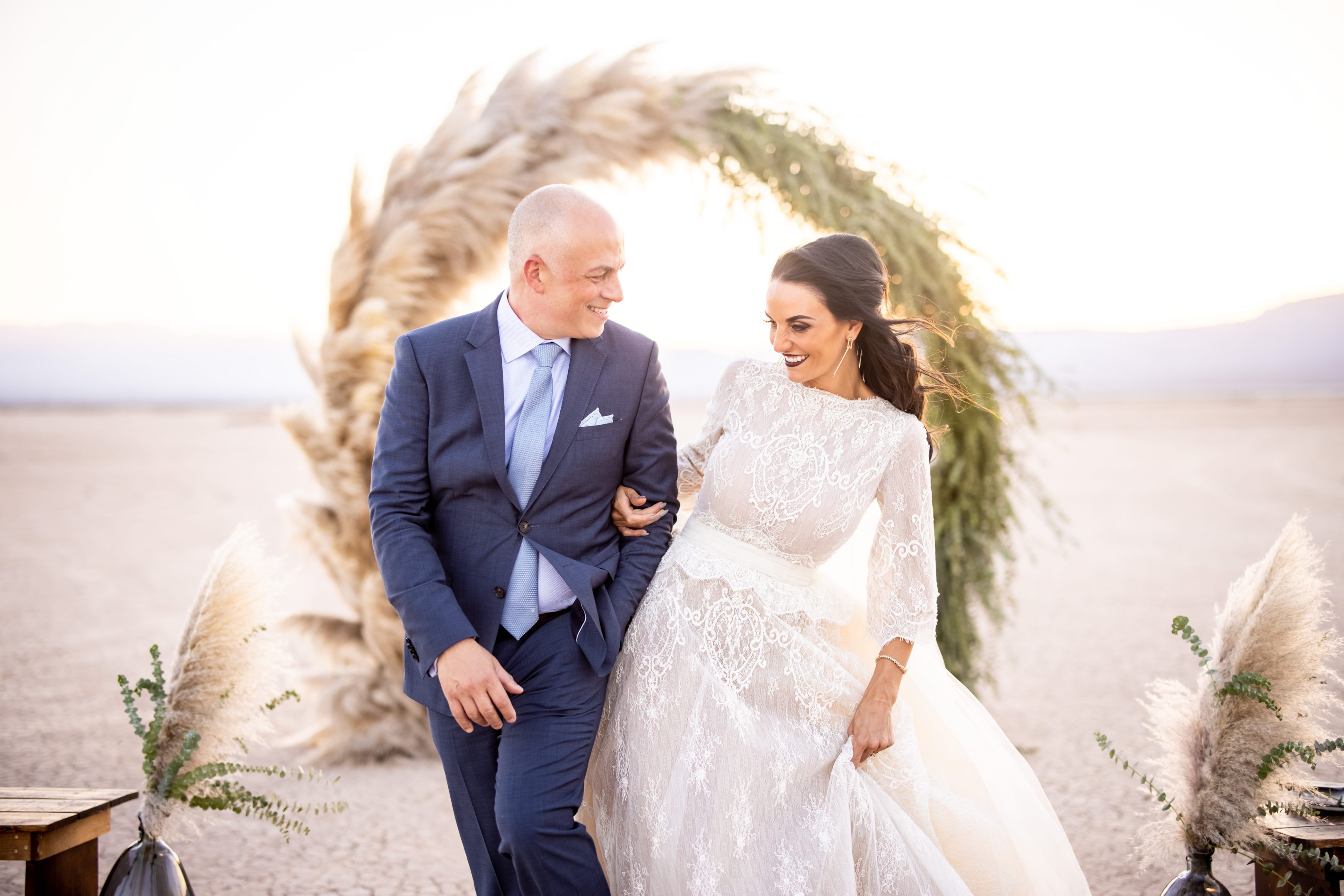 A wedding photographer capturing candid moments during a wedding ceremony