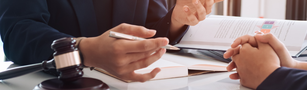 A public defender representing a client in court, showcasing the role of public defenders in providing legal aid to those who cannot afford private attorneys.