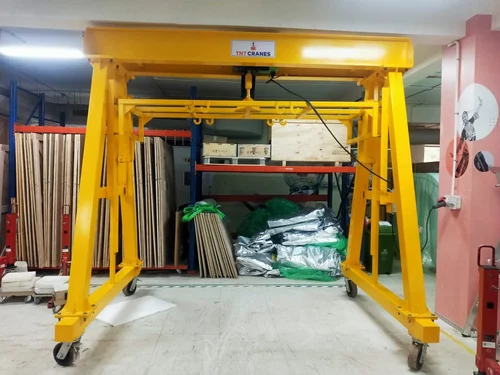 A frame crane in a factory setting