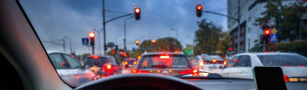 An image showing a flashing red light at an intersection 