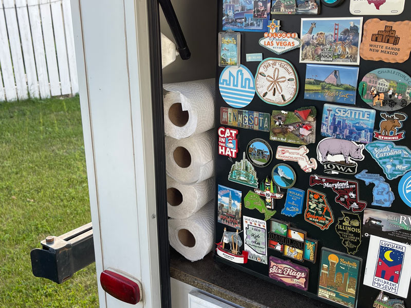 We store our paper towel in our outdoor RV kitchen next to the fridge.