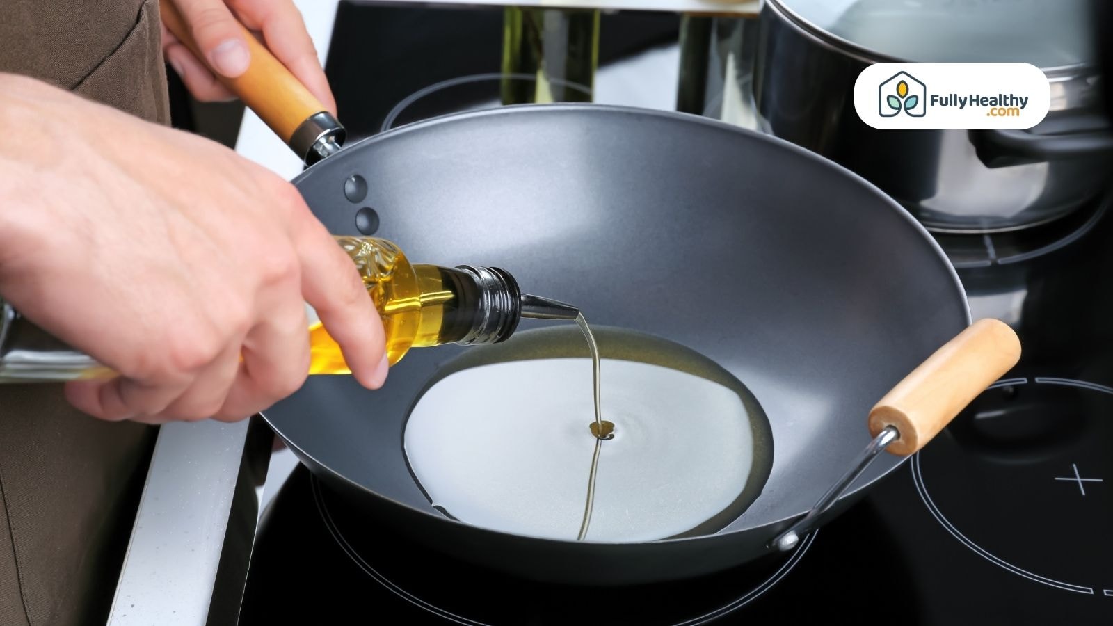 Olive oil being poured into nonstick frying pan on stove