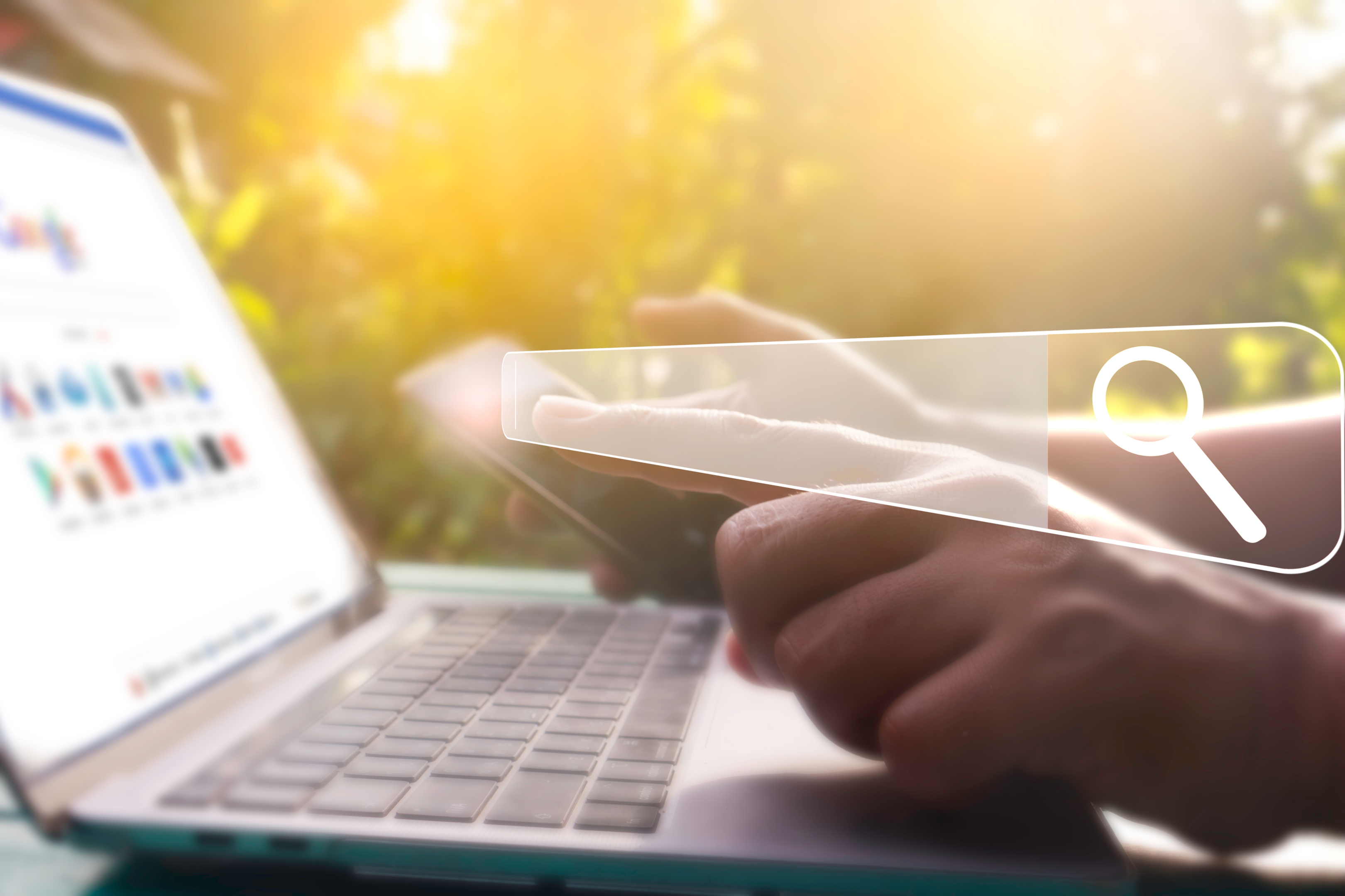 a person checks their phone and laptop to search online for more information