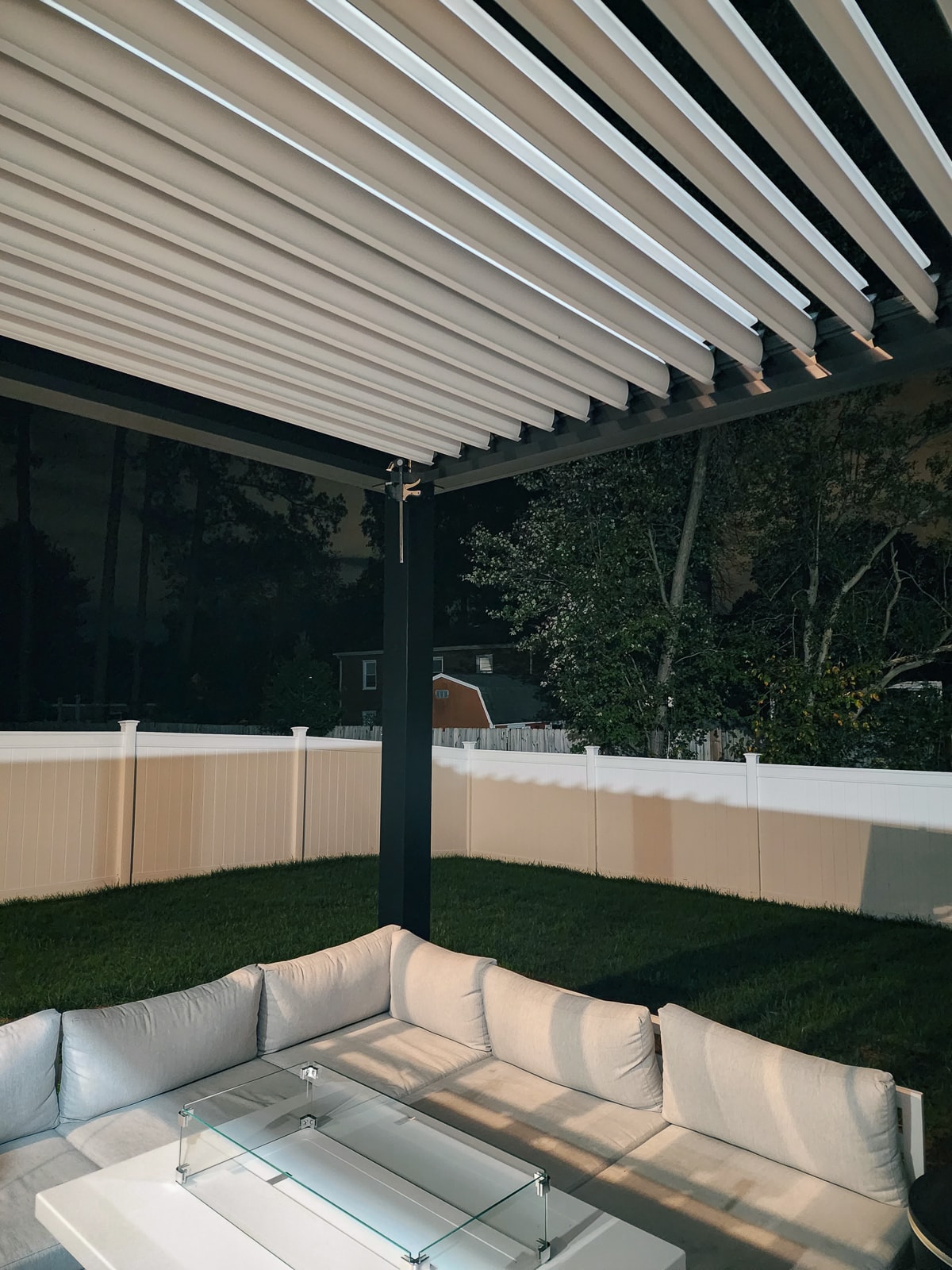 Outdoor seating under the louvered roof pergola.