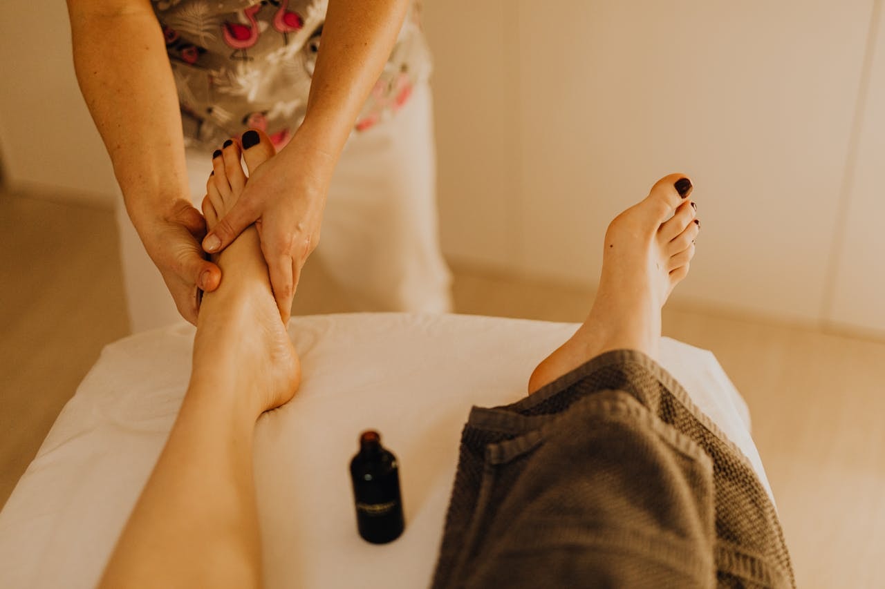 Foot massage focused on the arch and heel to relieve foot pain and reduce muscle tension after long hours on your feet.