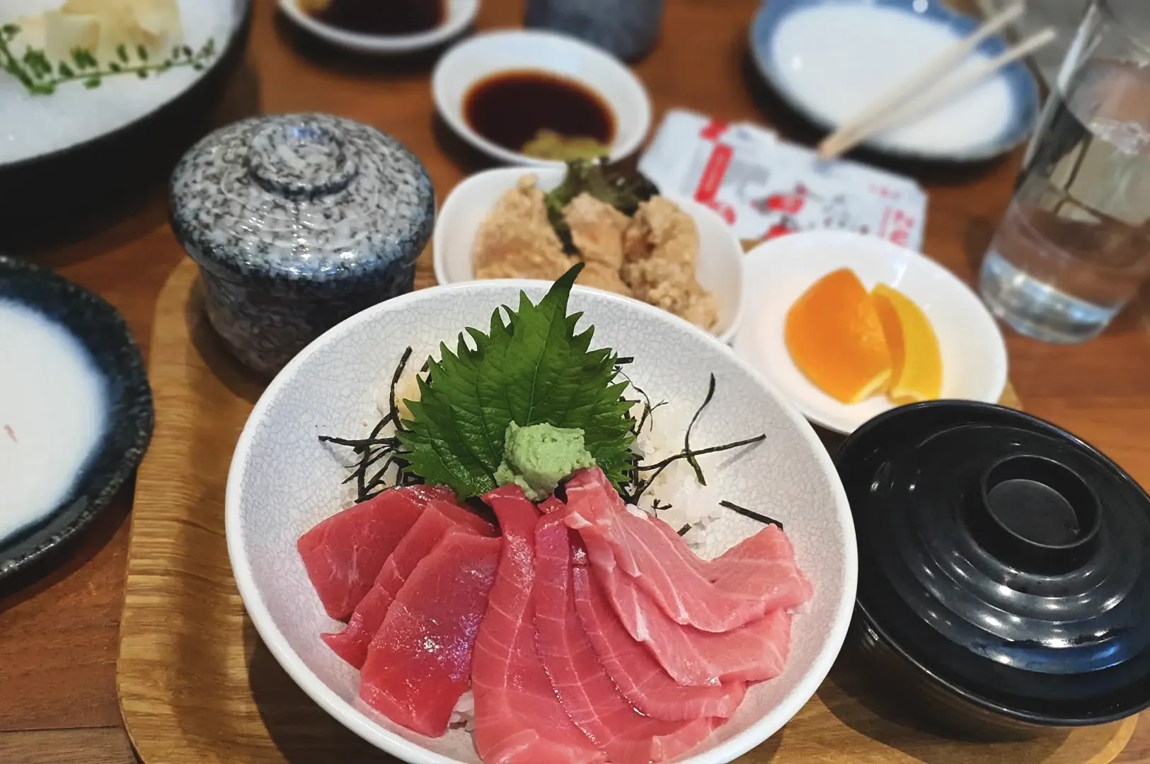 A generous premium tuna donburi bowl from Kuro Maguro at Guoco Tower, highlighting high-quality maguro sashimi slices and fresh wasabi.