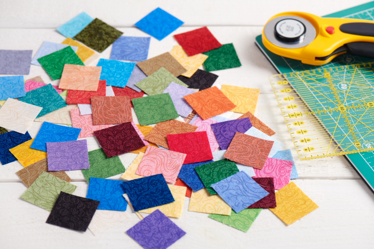 Arranging fabric squares to create a quilt top