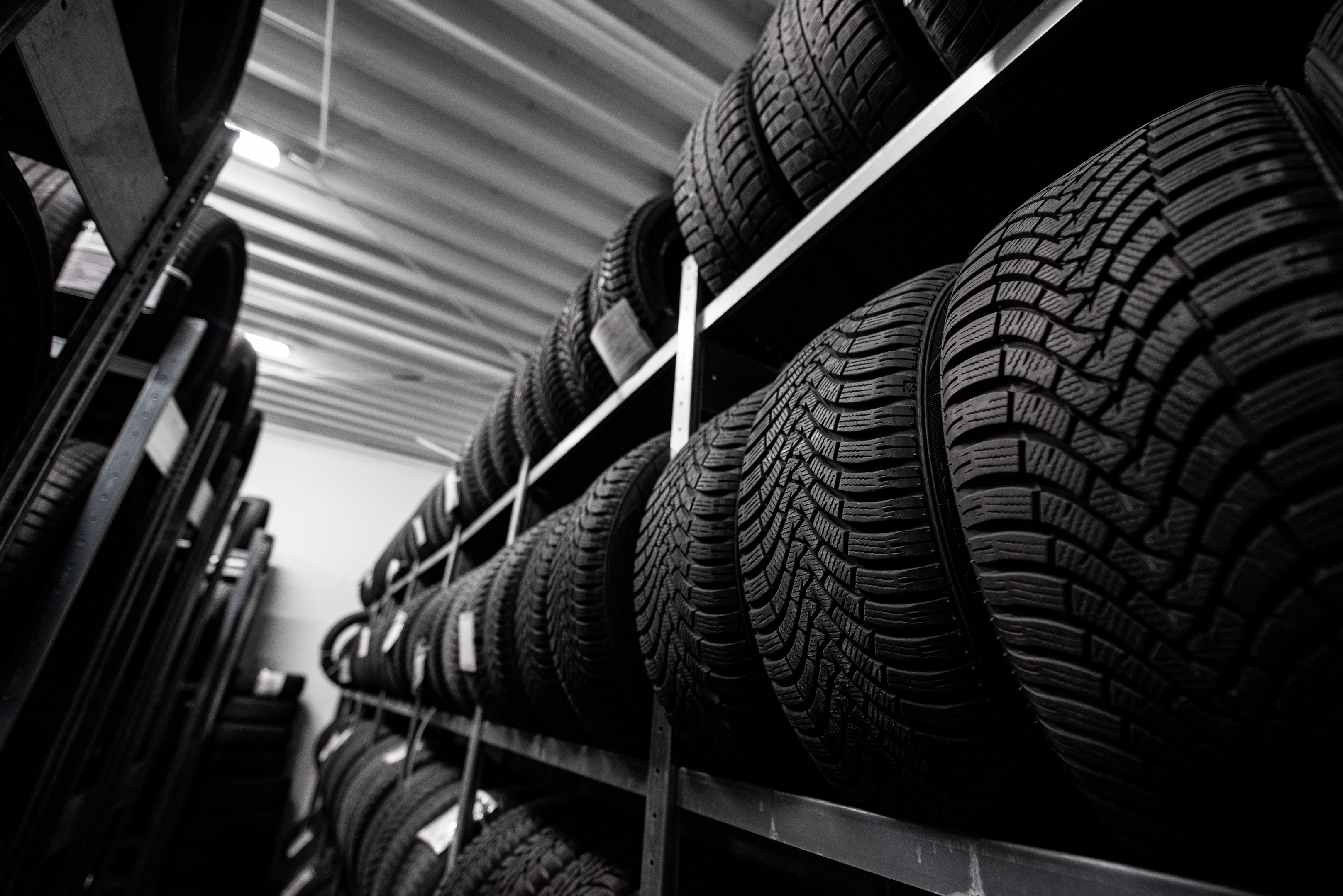 Rows of tires on a rack.