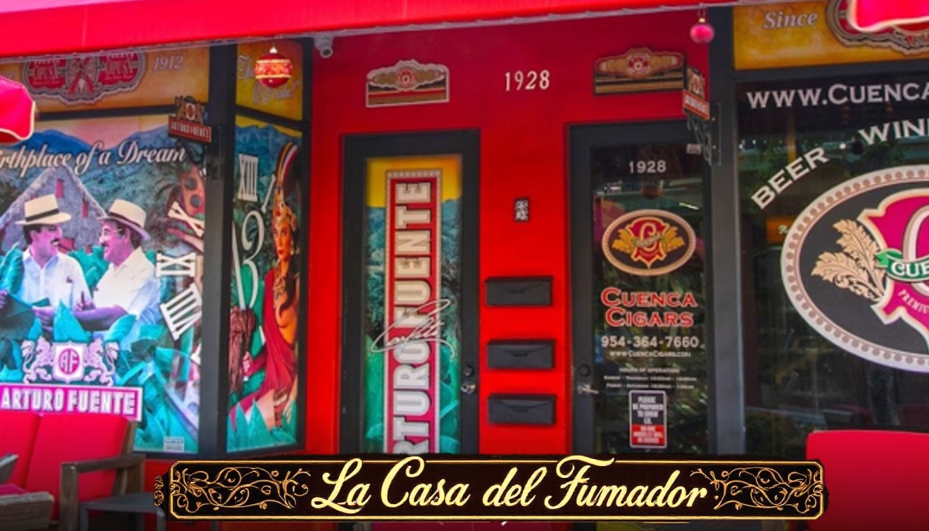 A storefront displaying a variety of cigars for sale.