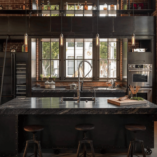 Industrial vintage pendant lights with slim metal frames and exposed Edison bulbs hanging above a modern kitchen island, stylish vintage lighting idea.