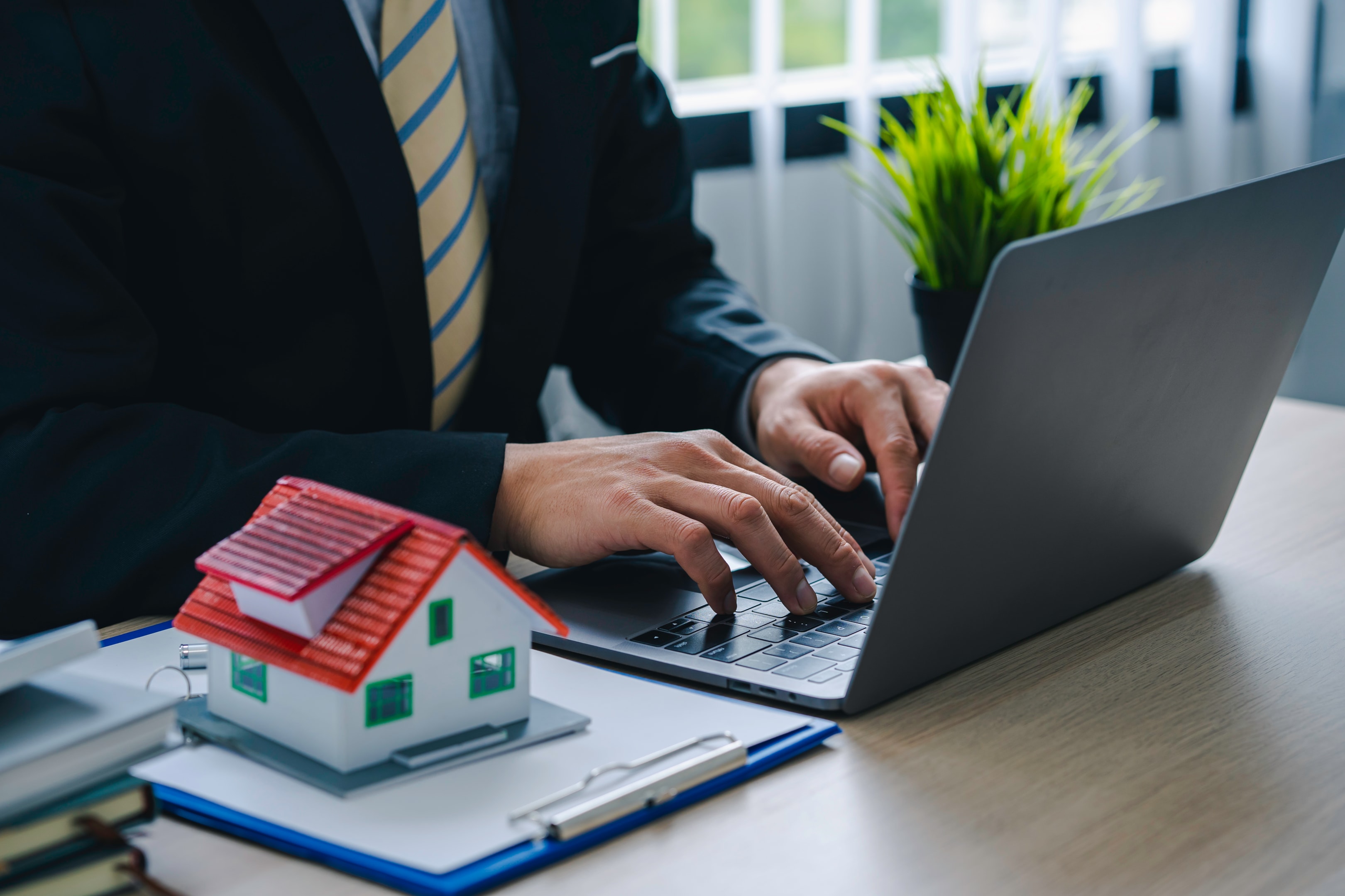 property manager at faa property typing on a computer