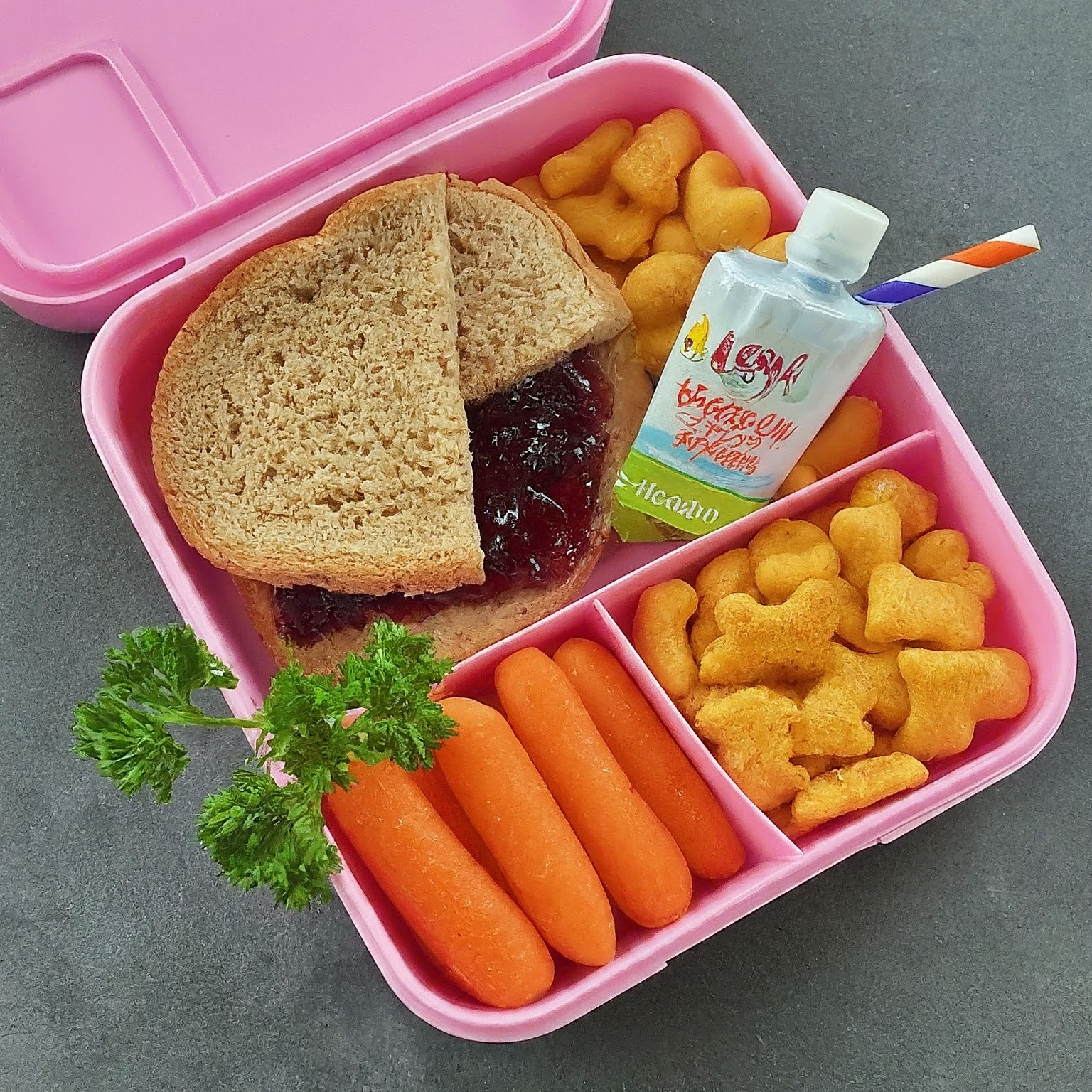 My daughters go to lunch. Jelly Sandwich, baby carrots, gold fish and yogurt pouch.