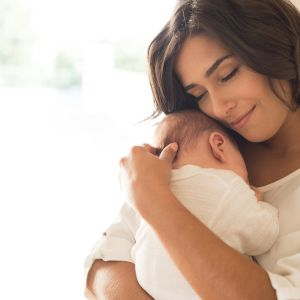 Baby being comforted after chiropractic adjustment therapy for colic