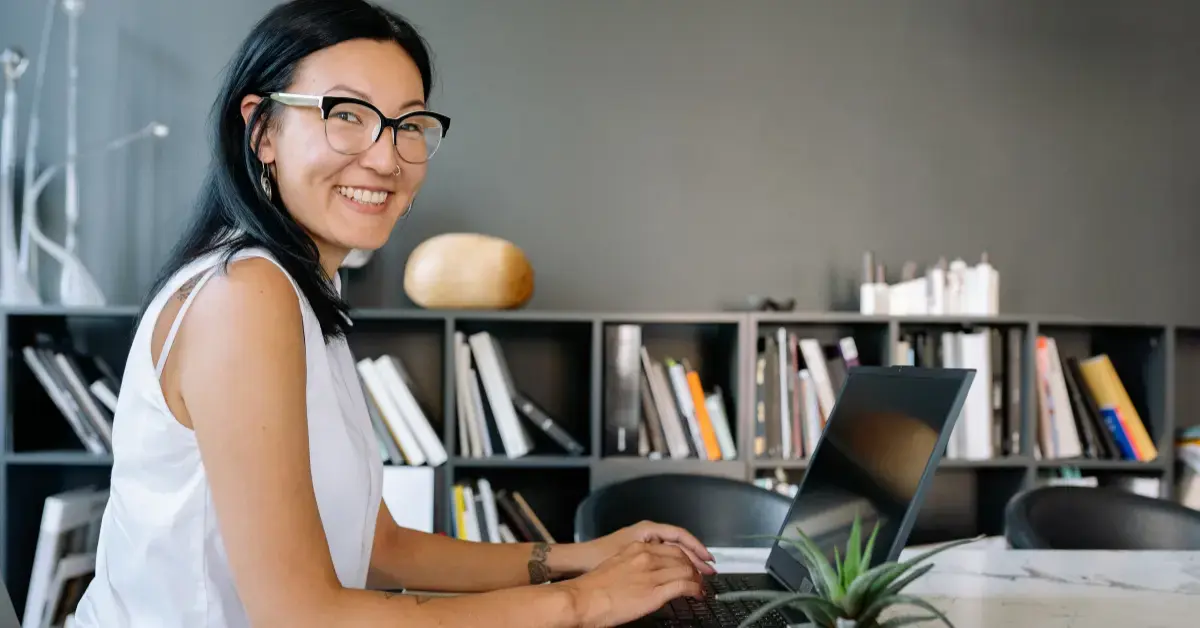 Woman reviewing income and tax planning for SEP IRA contribution limits 2026 on laptop.