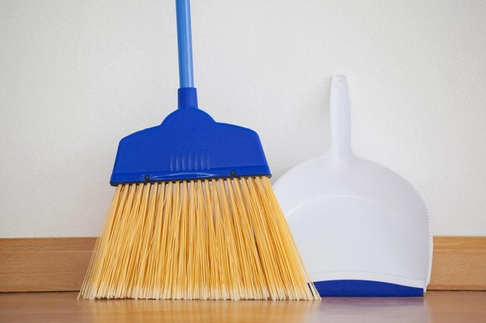Using a broom and dustpan is one of the low-impact cleaning techniques to remove loose dirt