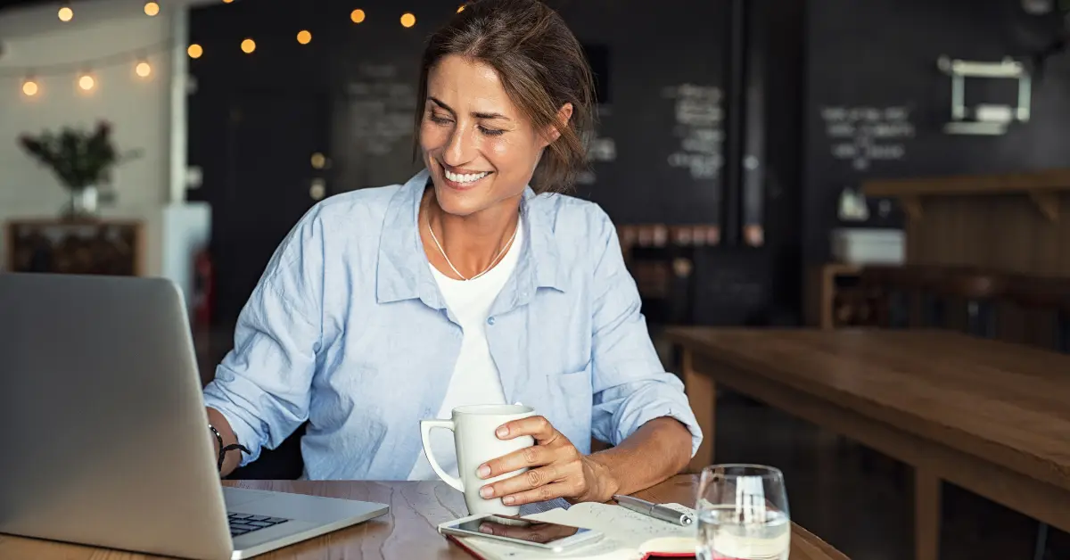 Woman reviewing tax documents while learning the difference between employee and contractor.