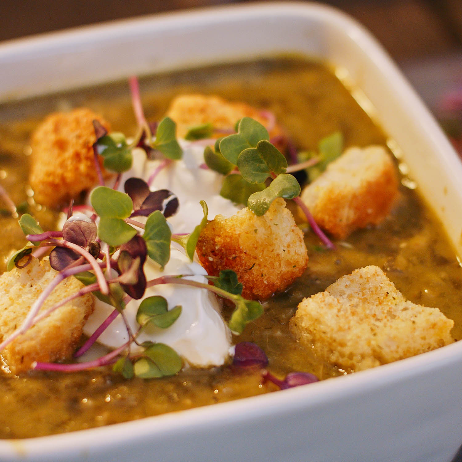 A bowl of low carb soup with vegetables and chicken