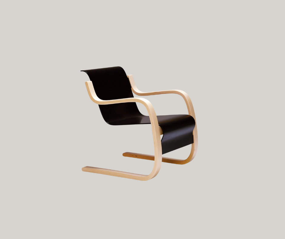 Black bent-plywood chair with light birch cantilevered frame and curved armrests, shown against a neutral background.