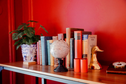 Knicknacks on a bookshelf at a cozy New England bed and breakfast