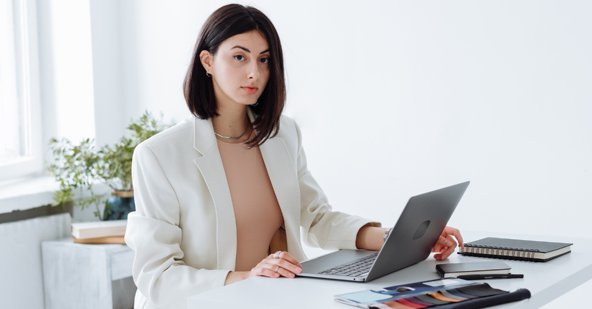 A woman organizing digital business tools to manage her OnlyFans content and income.