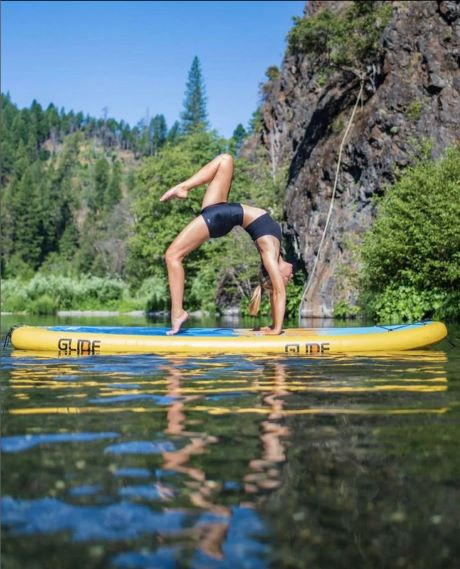 sup yoga on an inflatable paddle board
