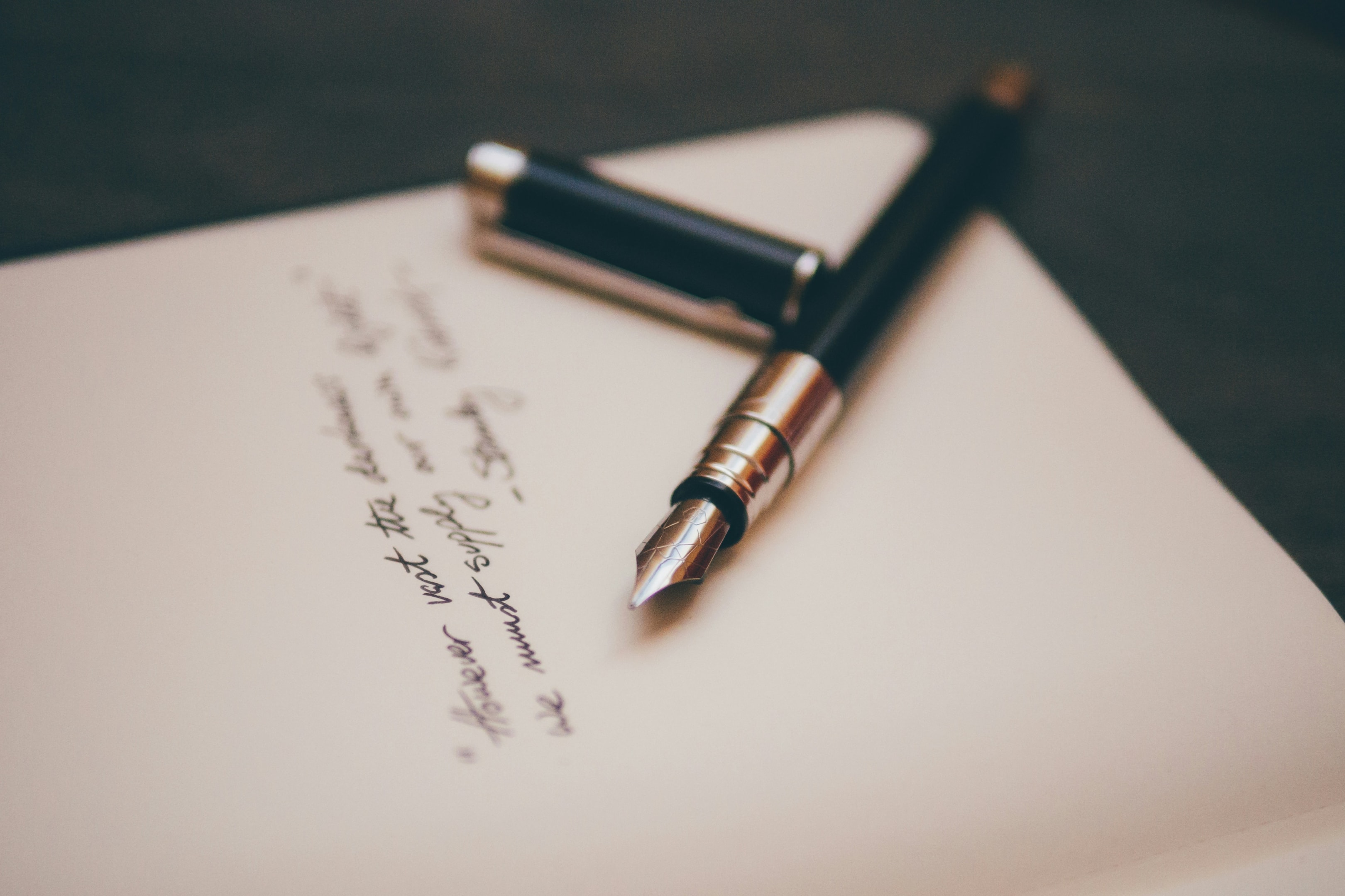 An image of poetry and a pen.