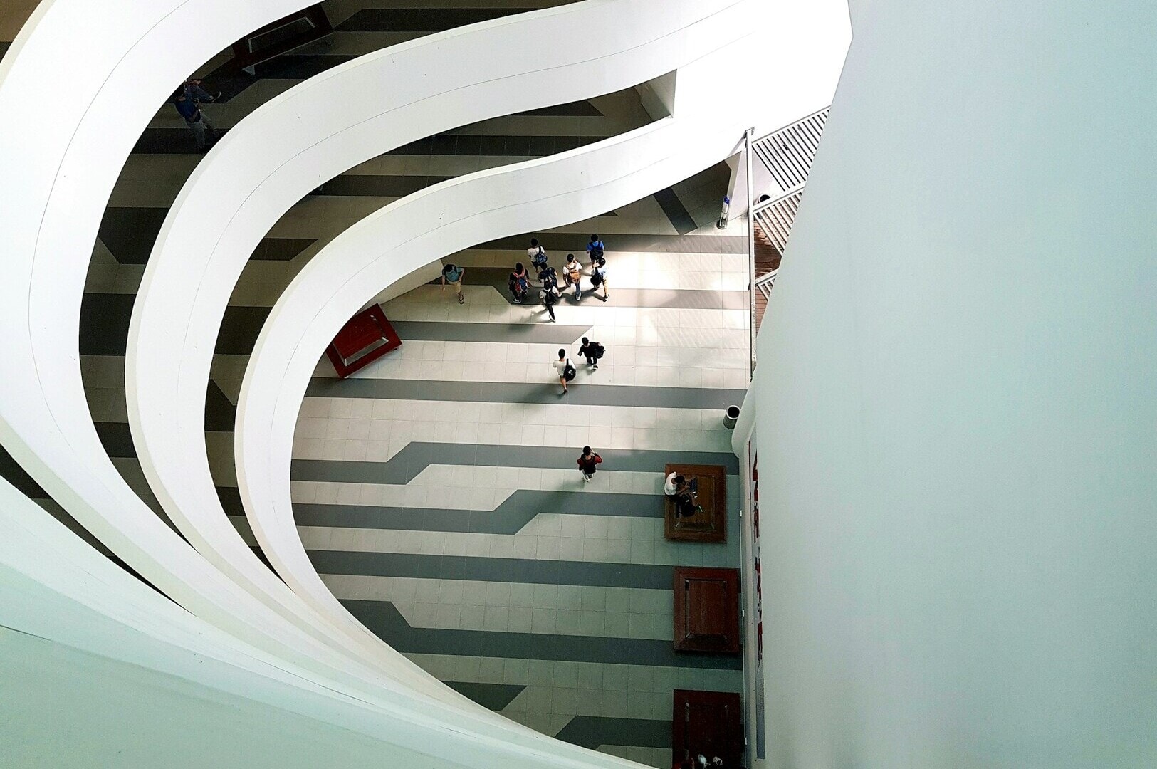 Interior view of a spiral staircase located in a building on the Singapore University Campus, emphasizing its elegance.