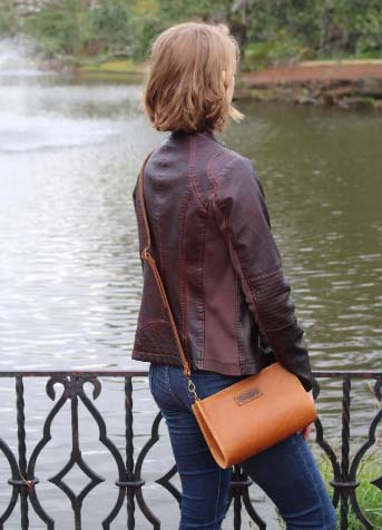 young lady enjoying beautiful nature with her handmade crossbody purse