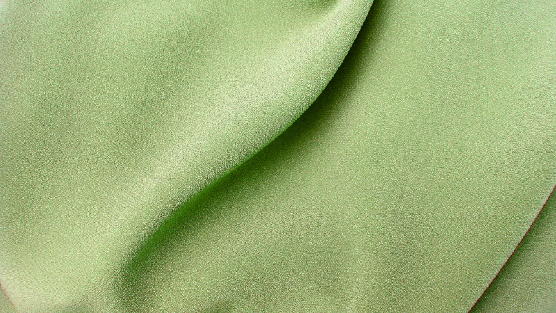 A close up of a light green cupro fabric.