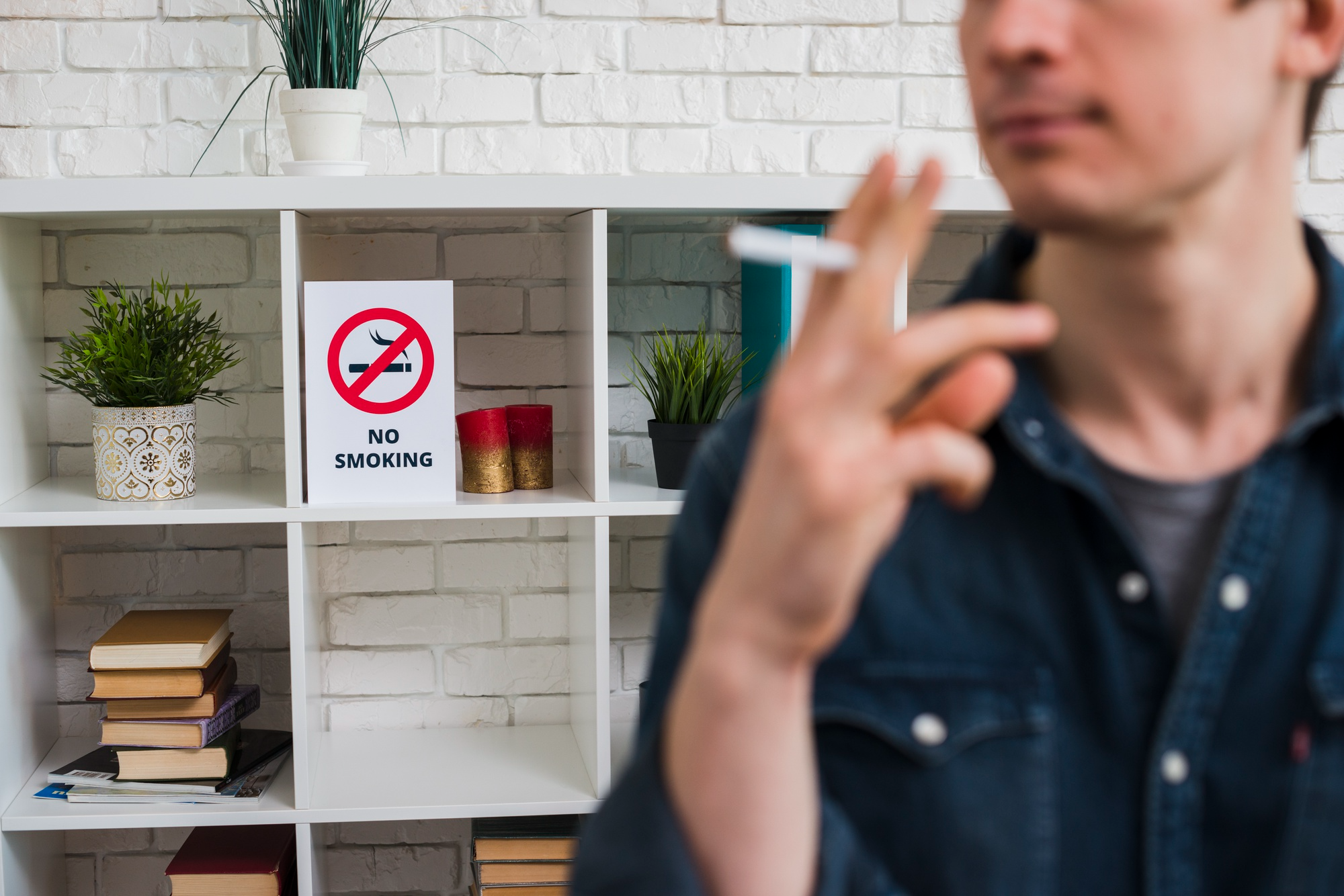 A man smoking in indoor public places