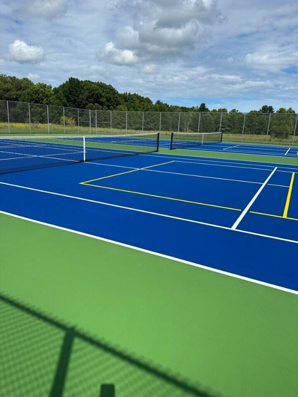 Renovated pickleball and tennis courts in Suamico, WI, featuring a durable, UV-resistant surface installed by Pro Track & Tennis using RiteWay's crack repair and Combination Surface® system.