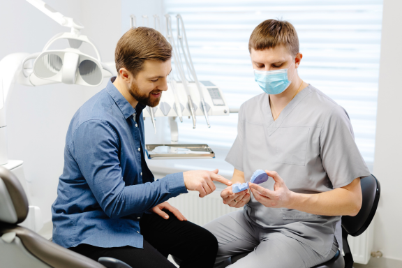 man asks dental surgeon about wisdom teeth removal in Calgary 