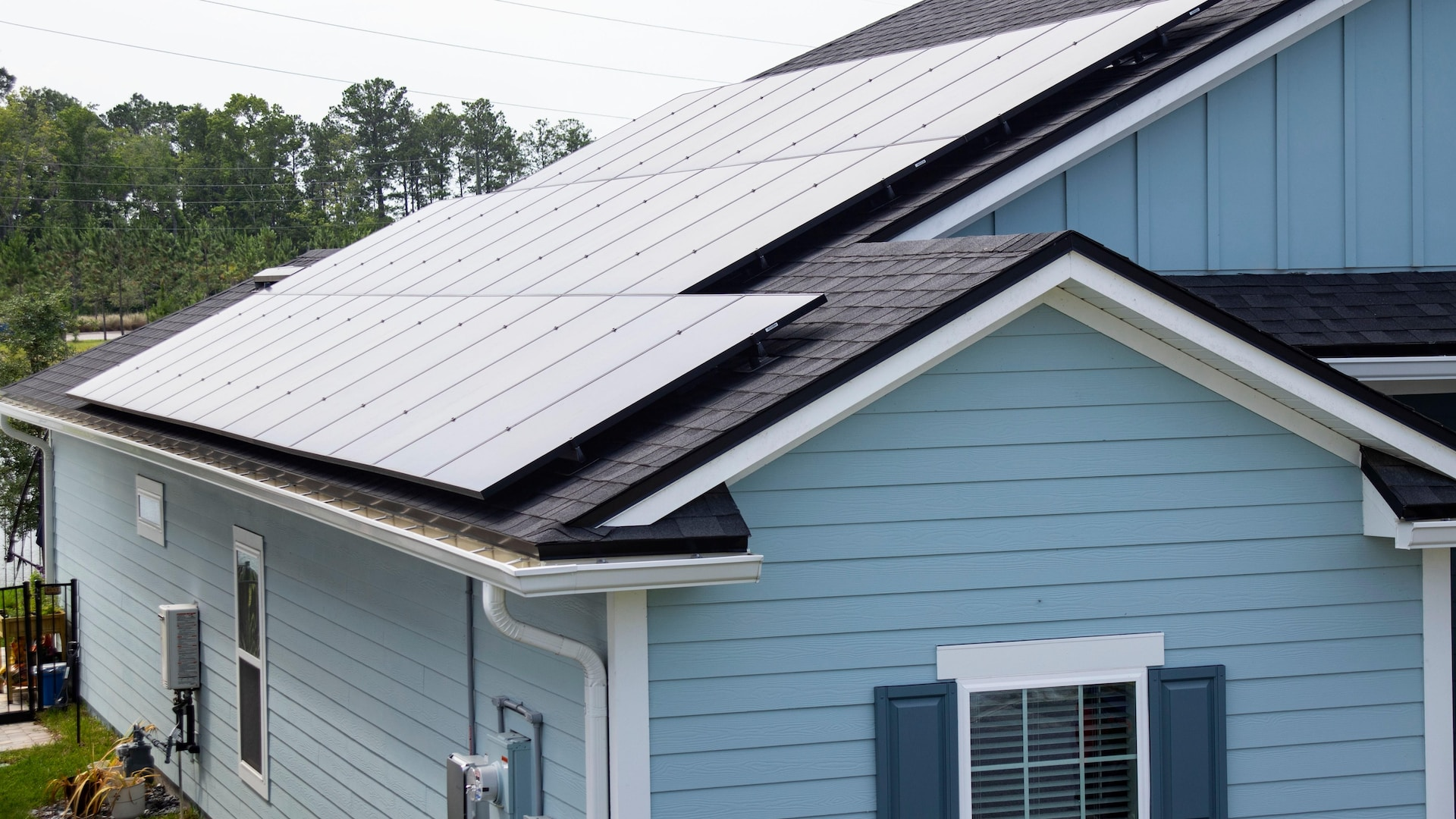 Solar panels mounted on a house for an EV charging station. 