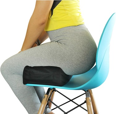 An image of a person sitting on a cushion with no pressure on their buttocks after undergoing natural BBL surgery.