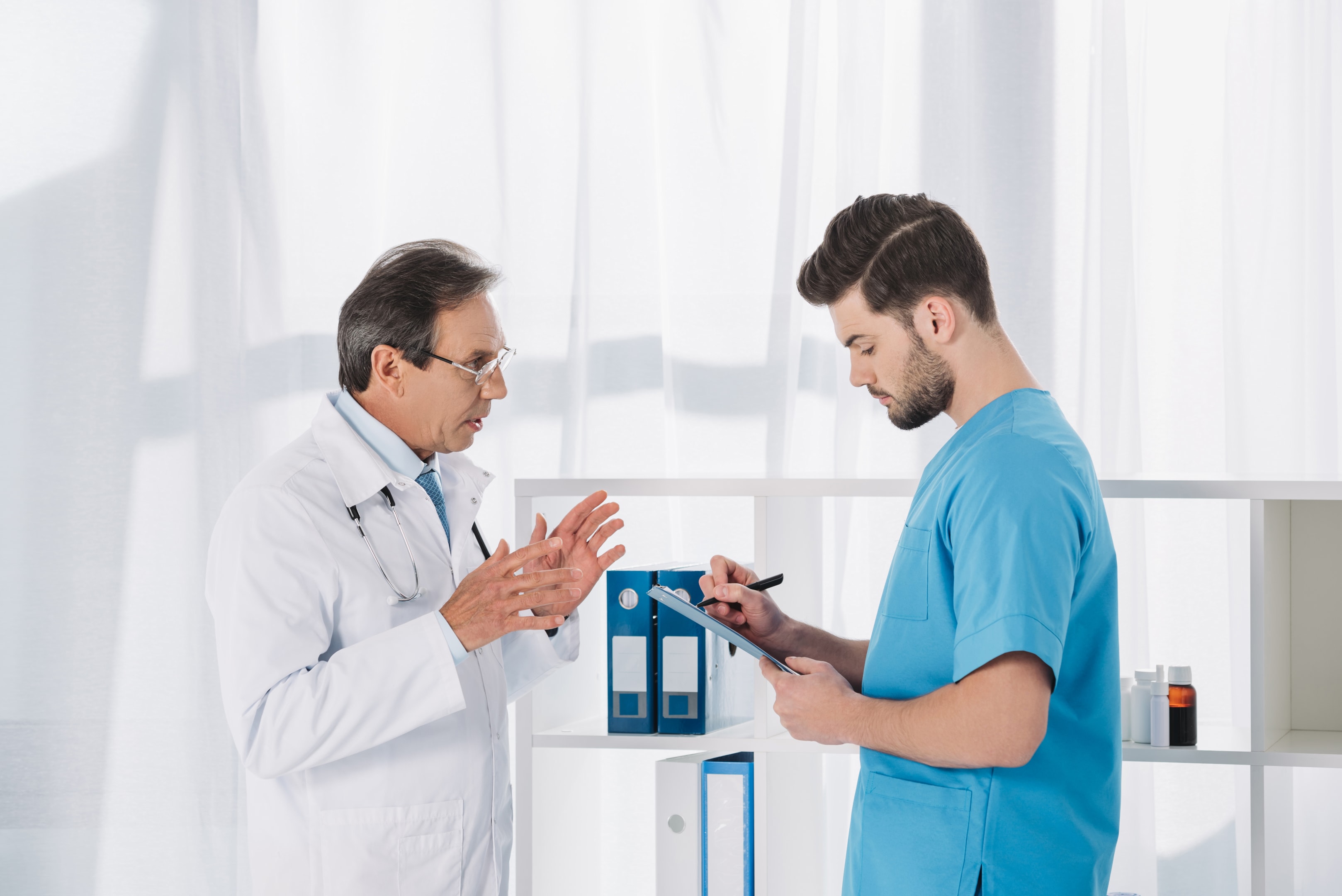 Doctor speaking with nurse