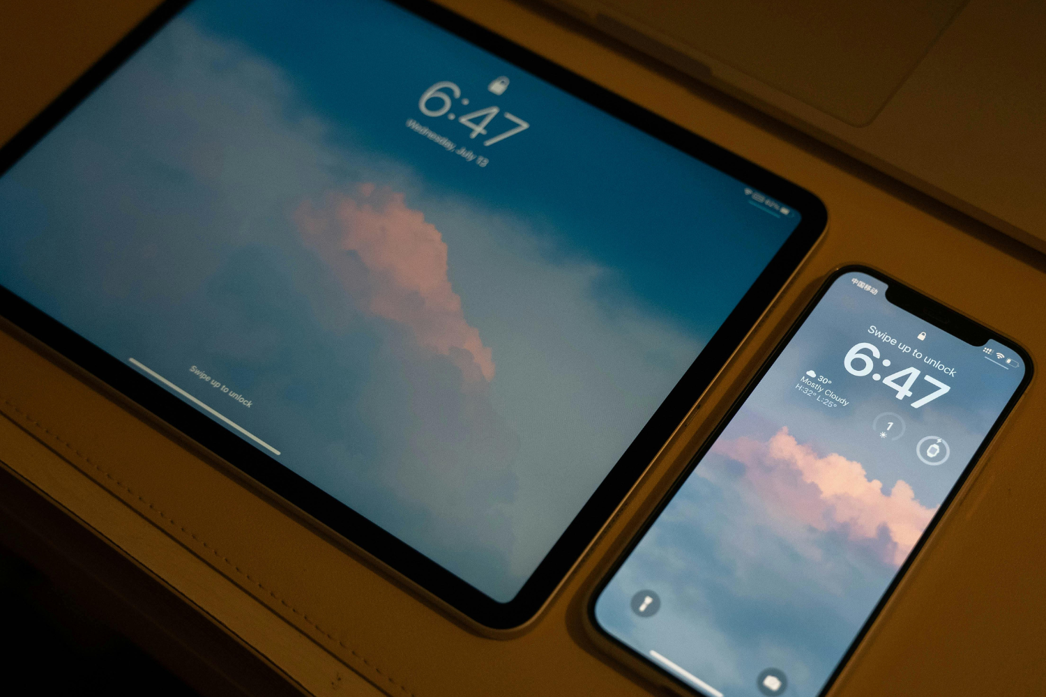 An iPad and an iPhone syncing.