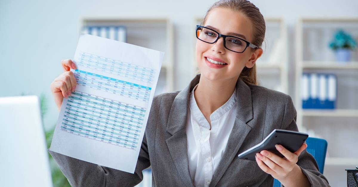  A smiling accountant holding documents and calculator, ready to help with OnlyFans taxes.