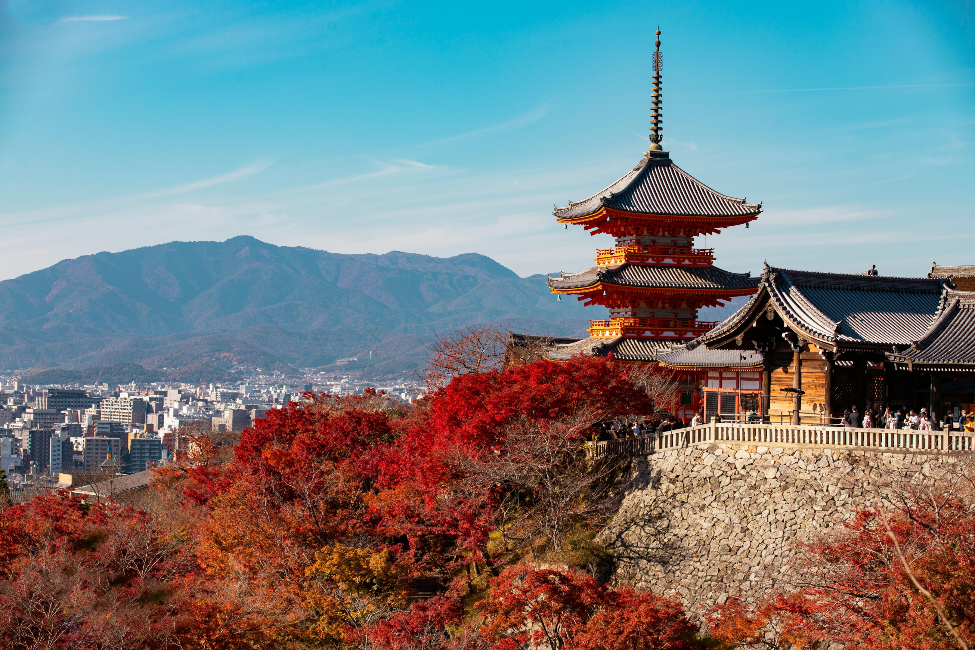 [IMAGE: Clear blue sky over Kyoto's mountain backdrop with autumn colors. Photo by Thắng Văn on Pexels.