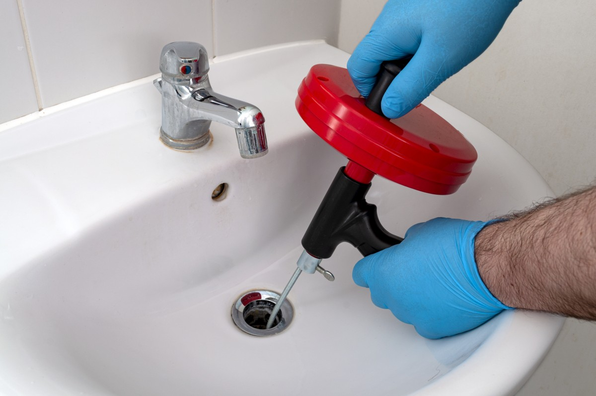 Use a drain snake to clean your clogged bathroom sink drain