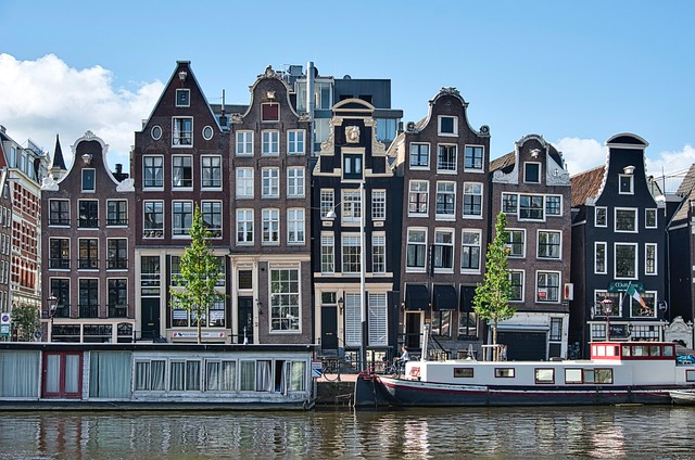 buildings in amsterdam historic on a canal