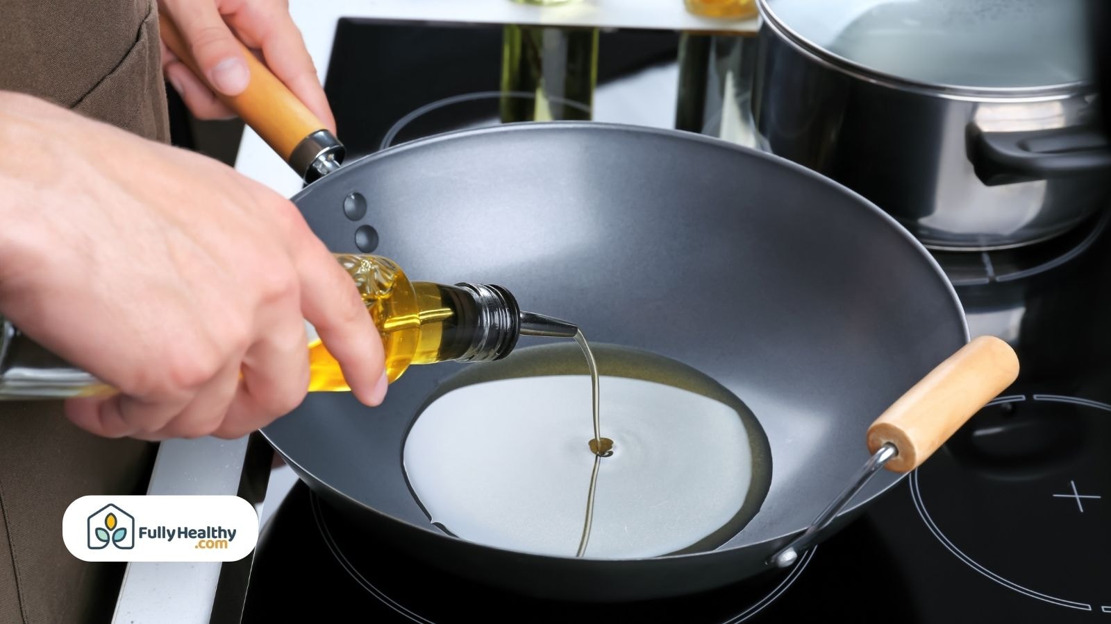 Person pouring olive oil into a frying pan on a stove
