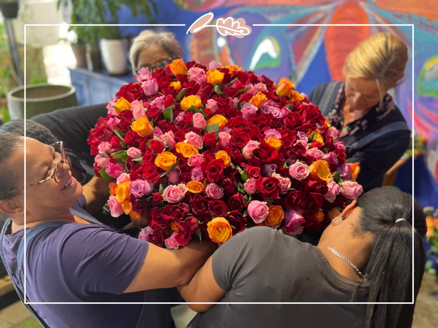 Florists at Fabulous Flowers and Gifts in the Western Cape arranging a vibrant bouquet of fresh flowers, showcasing their dedication and care. 