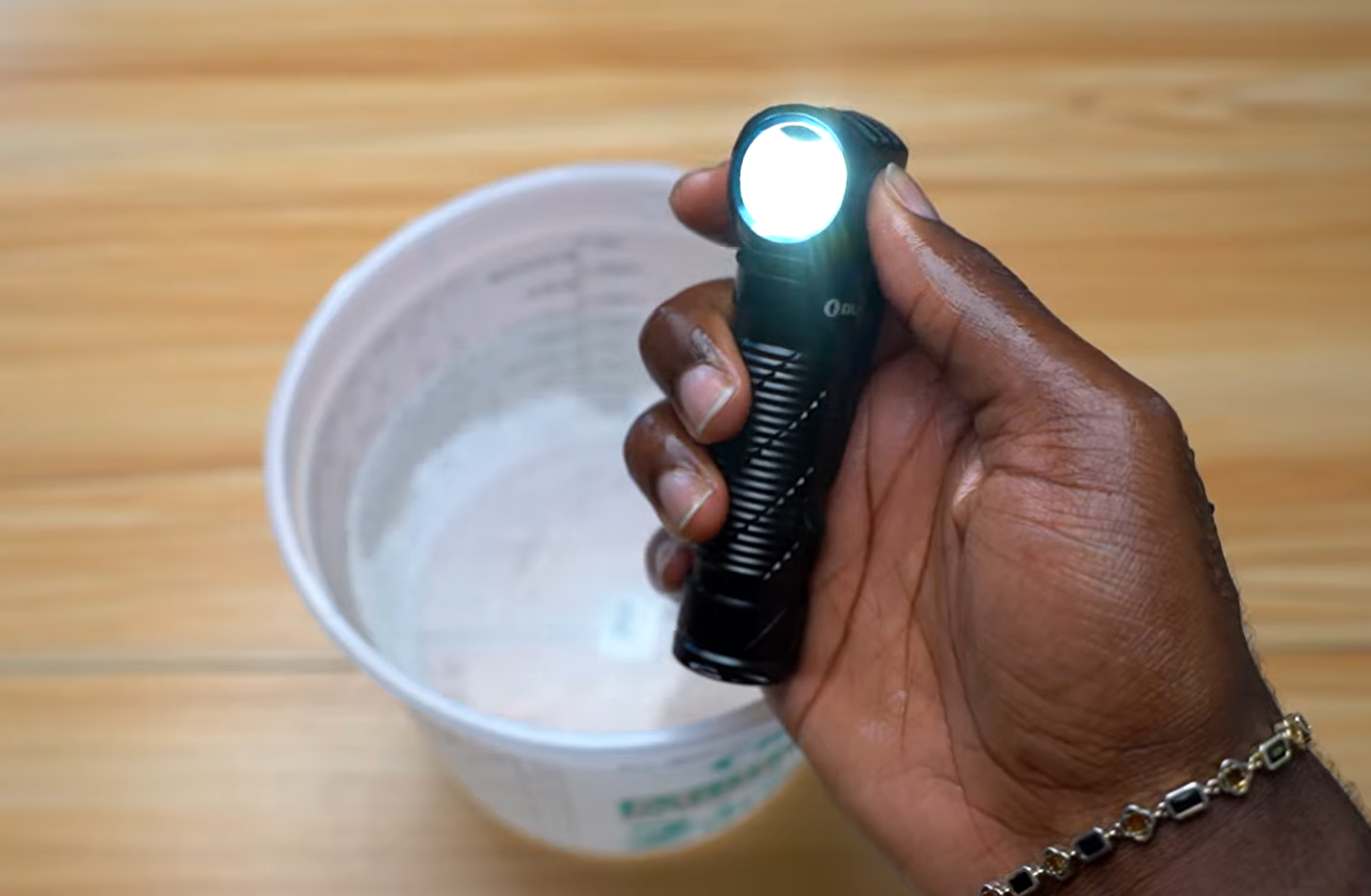 Olight Perun 3 submerged in water