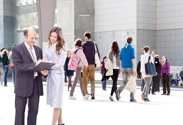 Businessman talking with businesswoman
