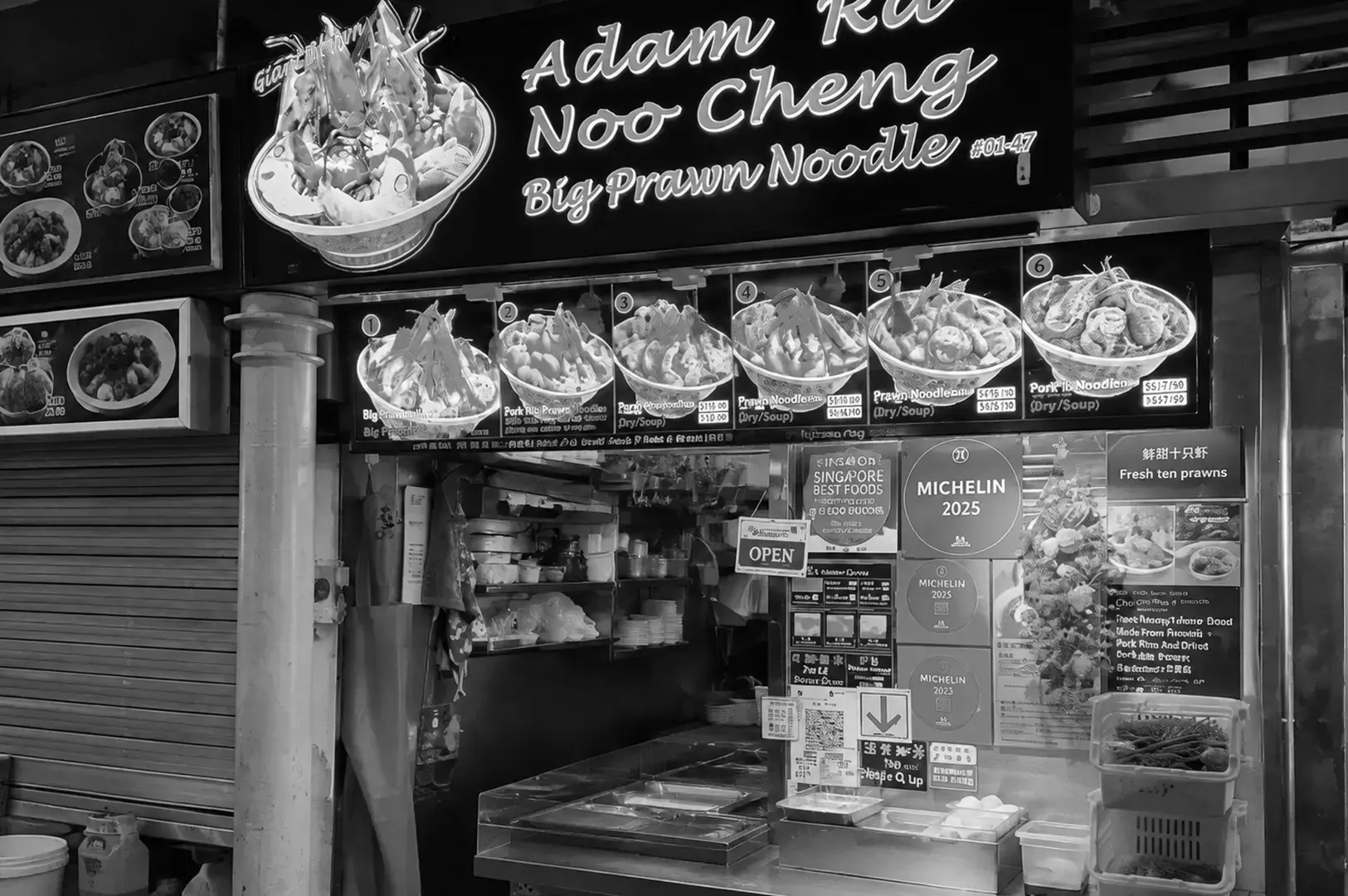 Adam Road Noo Cheng Big Prawn Noodle stall with award displays.